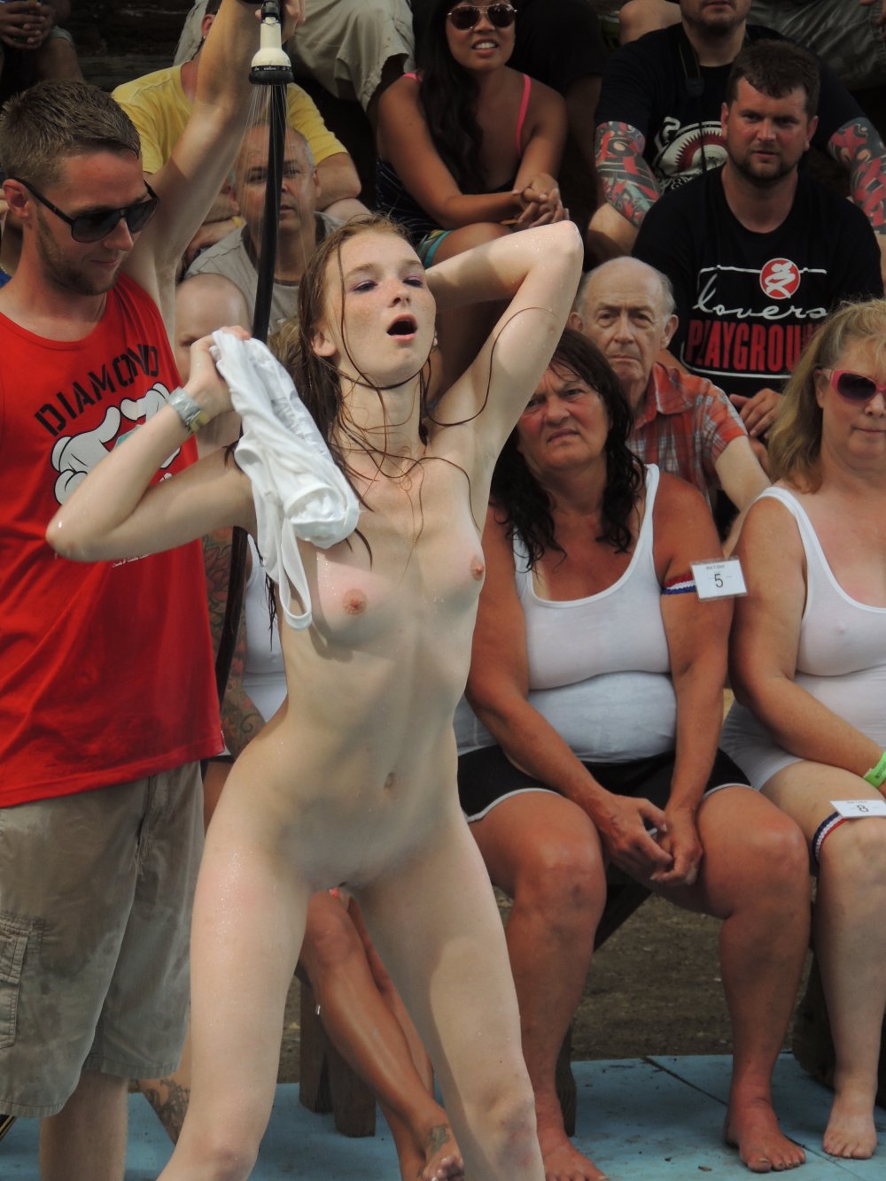 Girls undress in front of the public
