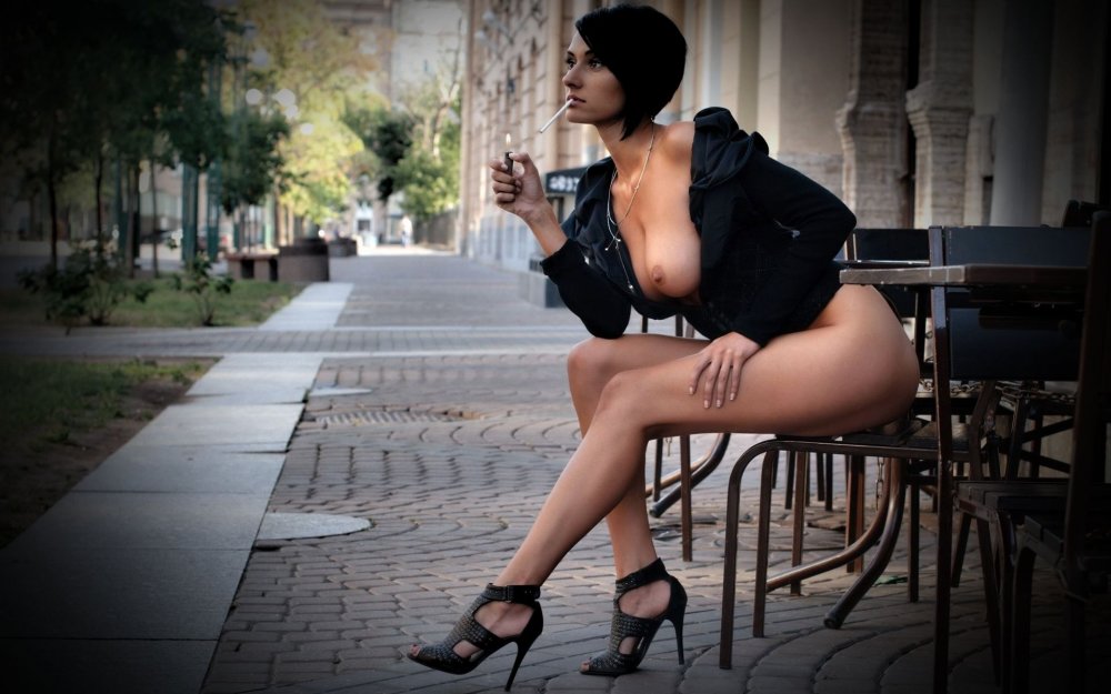 Naked brunette with a cigarette