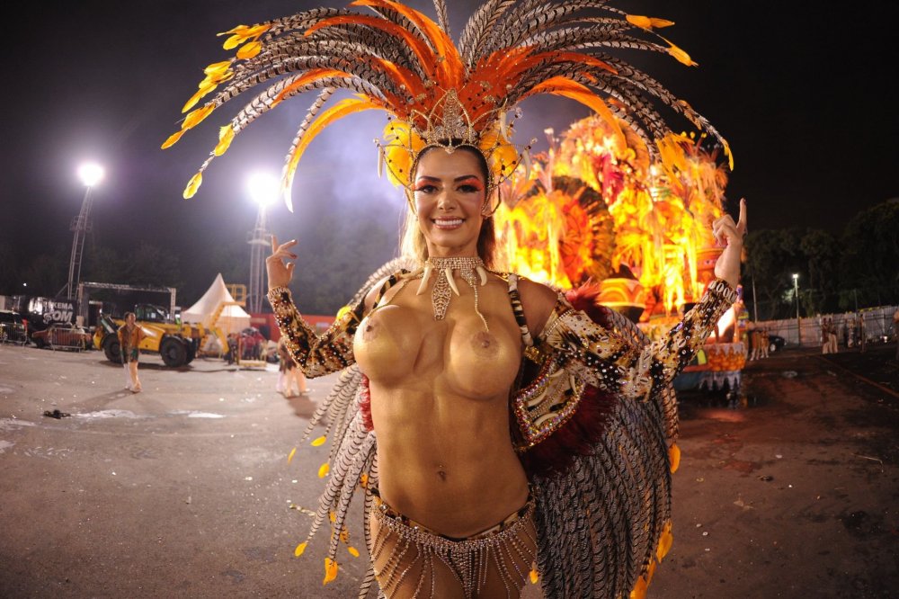 Girl in a carnival suit of nude