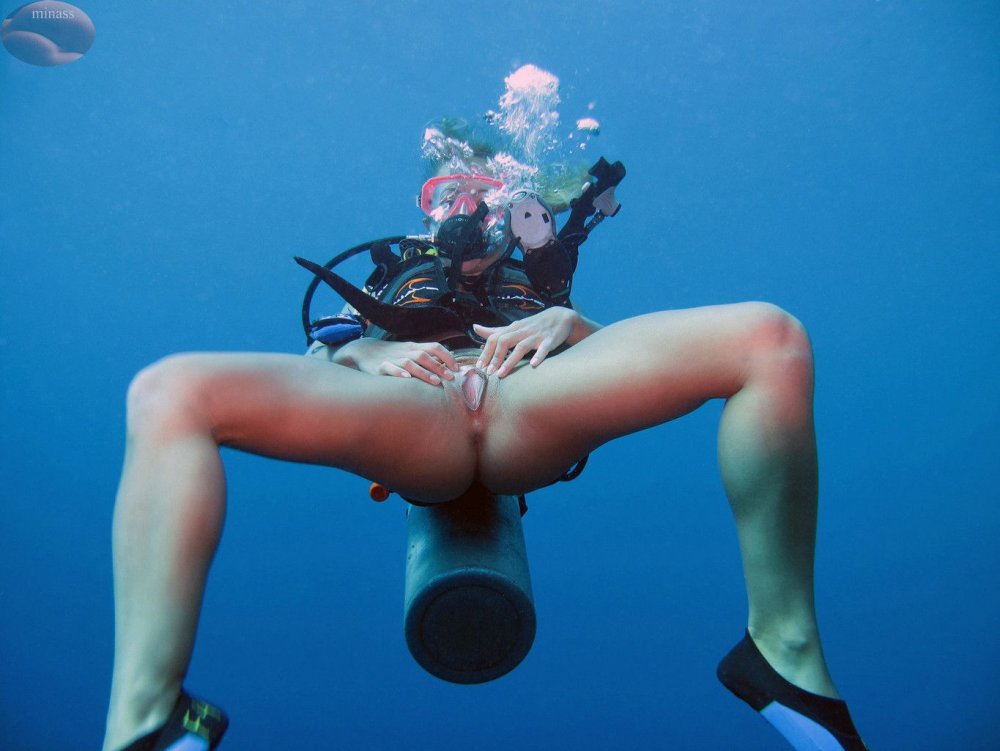 Naked women with flippers underwater
