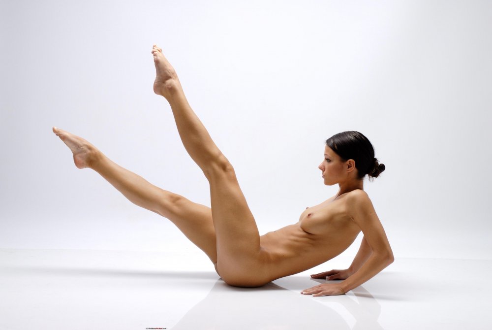 The girl is engaged in yoga naked