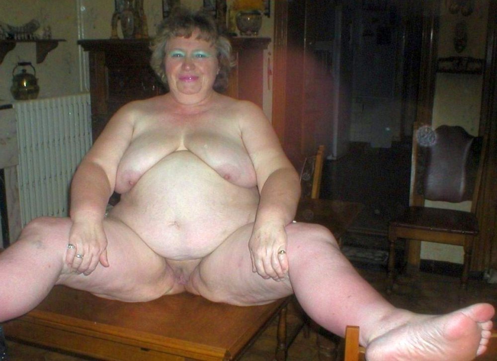 Naked fat old women in the kitchen