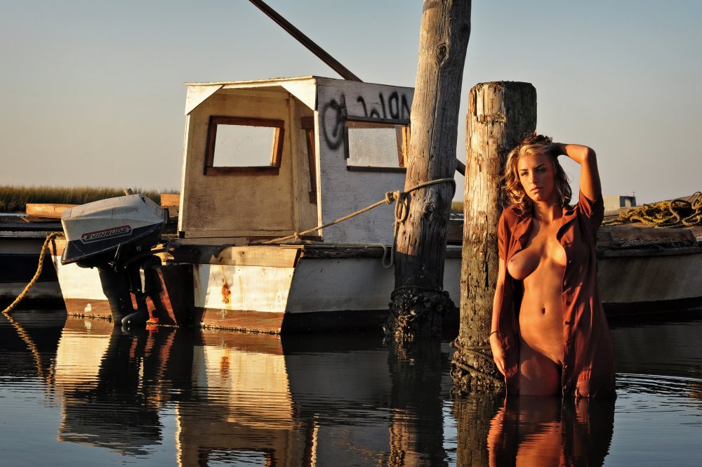 Naked women in a boat without panties