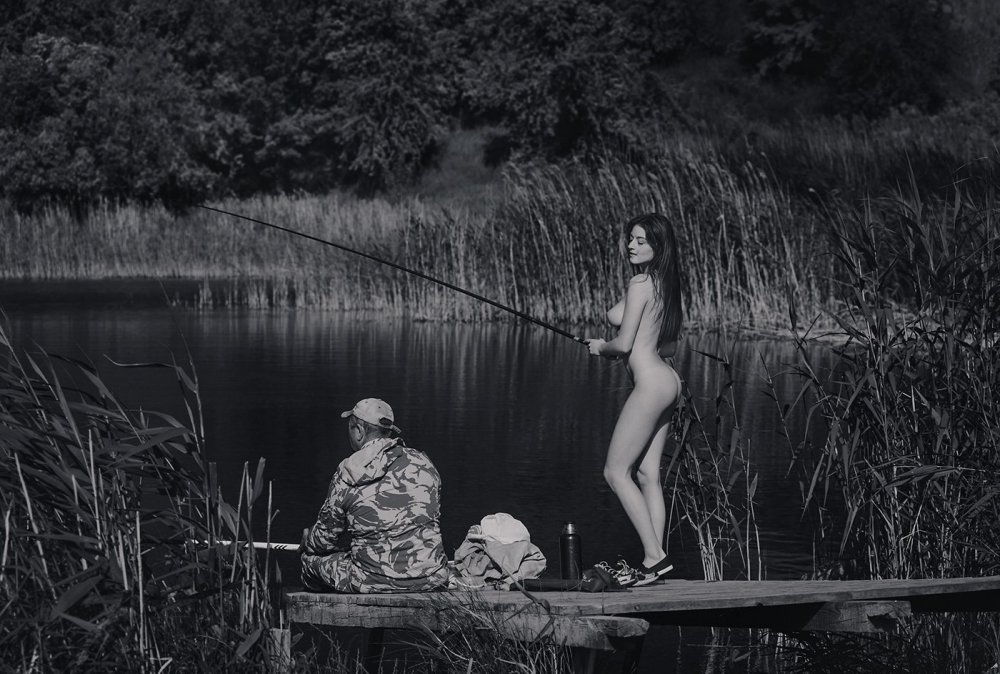 Naked beauty in a boat