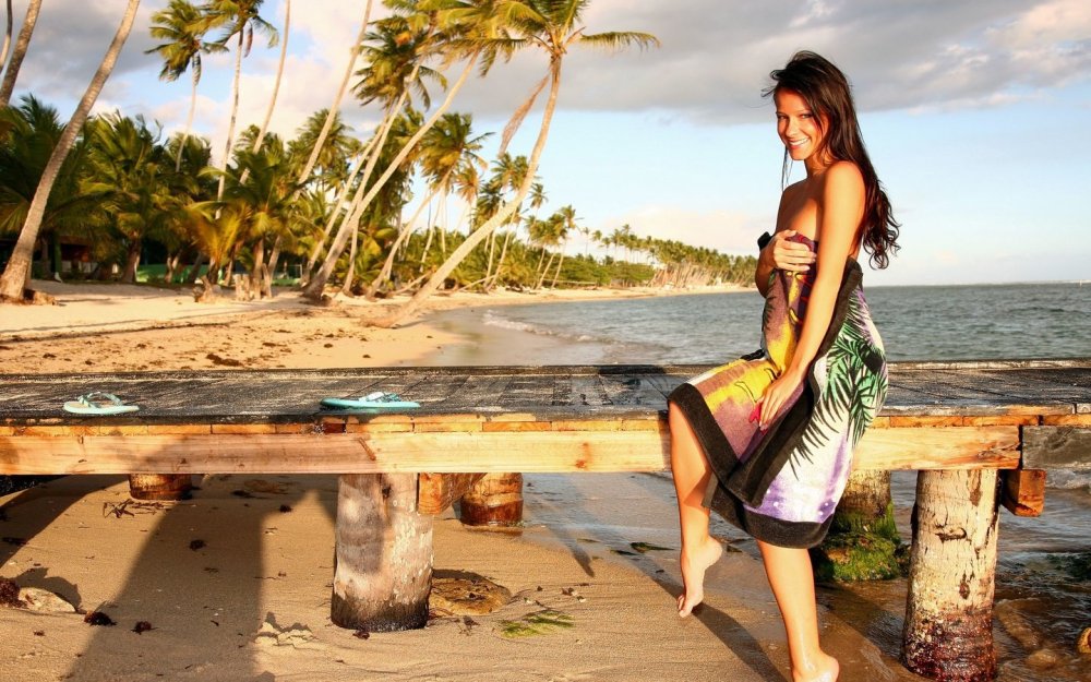 Girl in a dress on a tropical beach