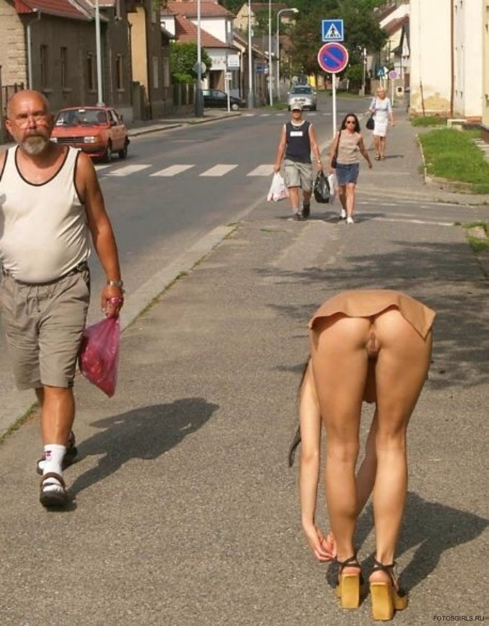 The girl undresses in public