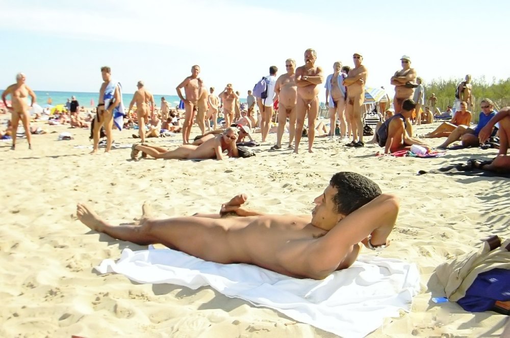 Naked guy on a public beach
