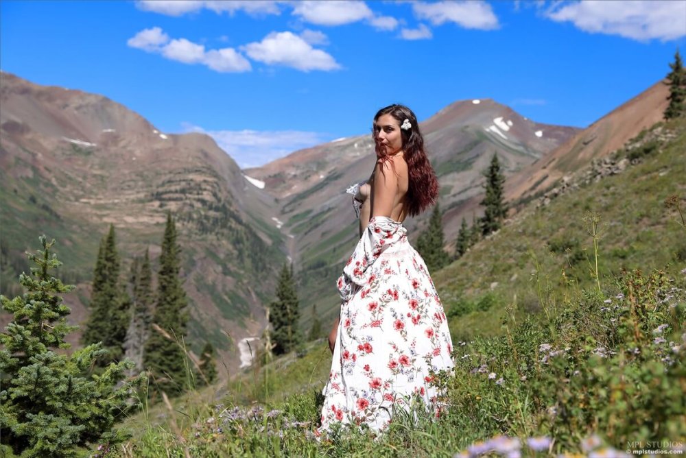 Girl in a hat in the forest