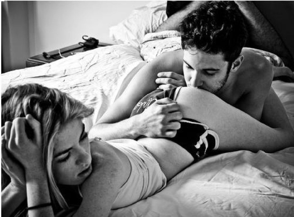 The guy kisses the girl in the ass