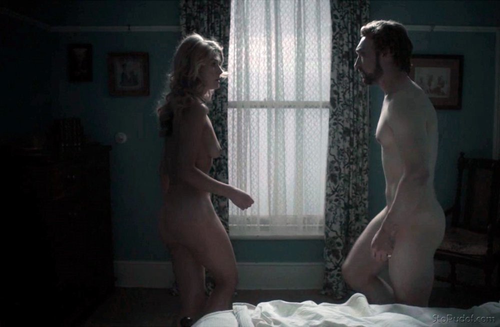Rosamund ration naked in front of the mirror