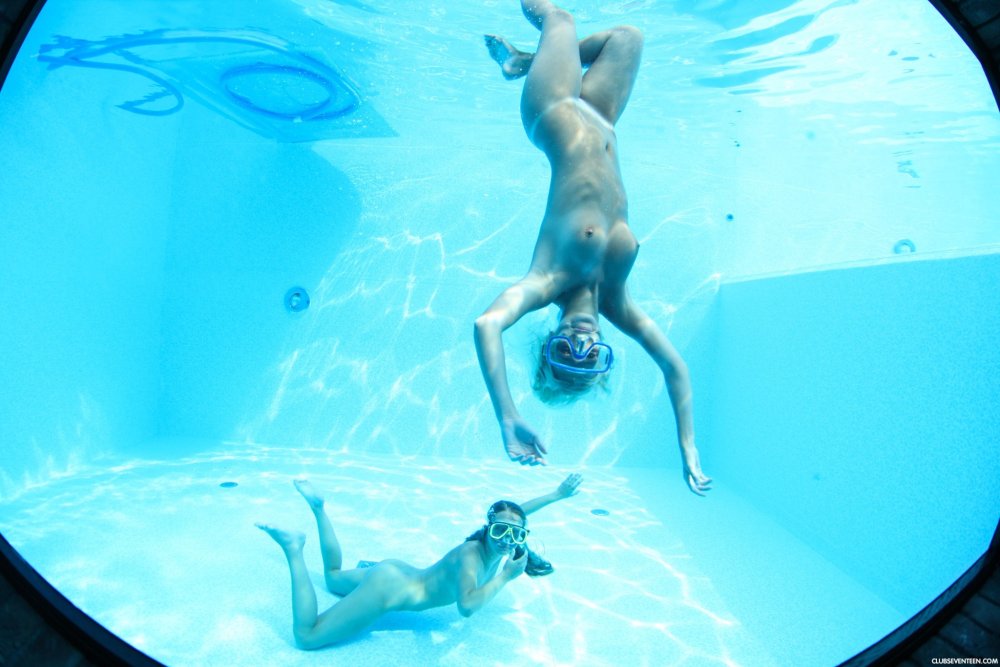 Naked swimmers underwater