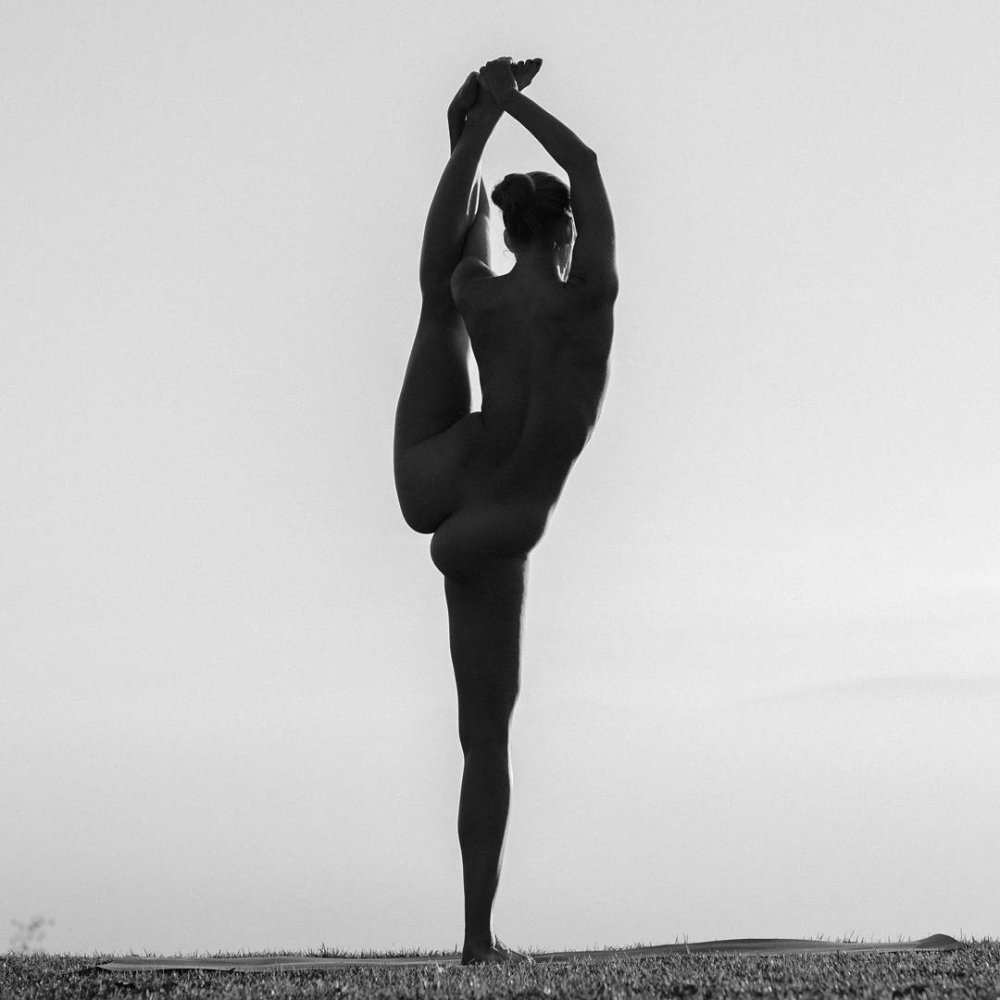 Nude yoga paired man woman