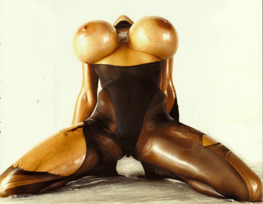 Silicone boobs with a carved face