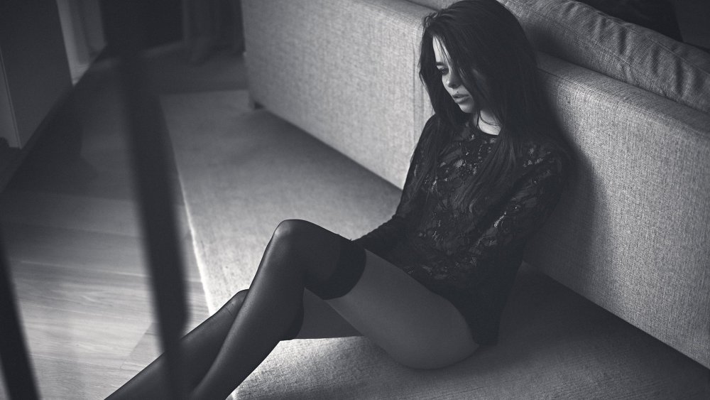 Girl on the floor in the dark