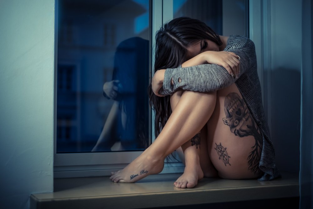 Brunette on the windowsill