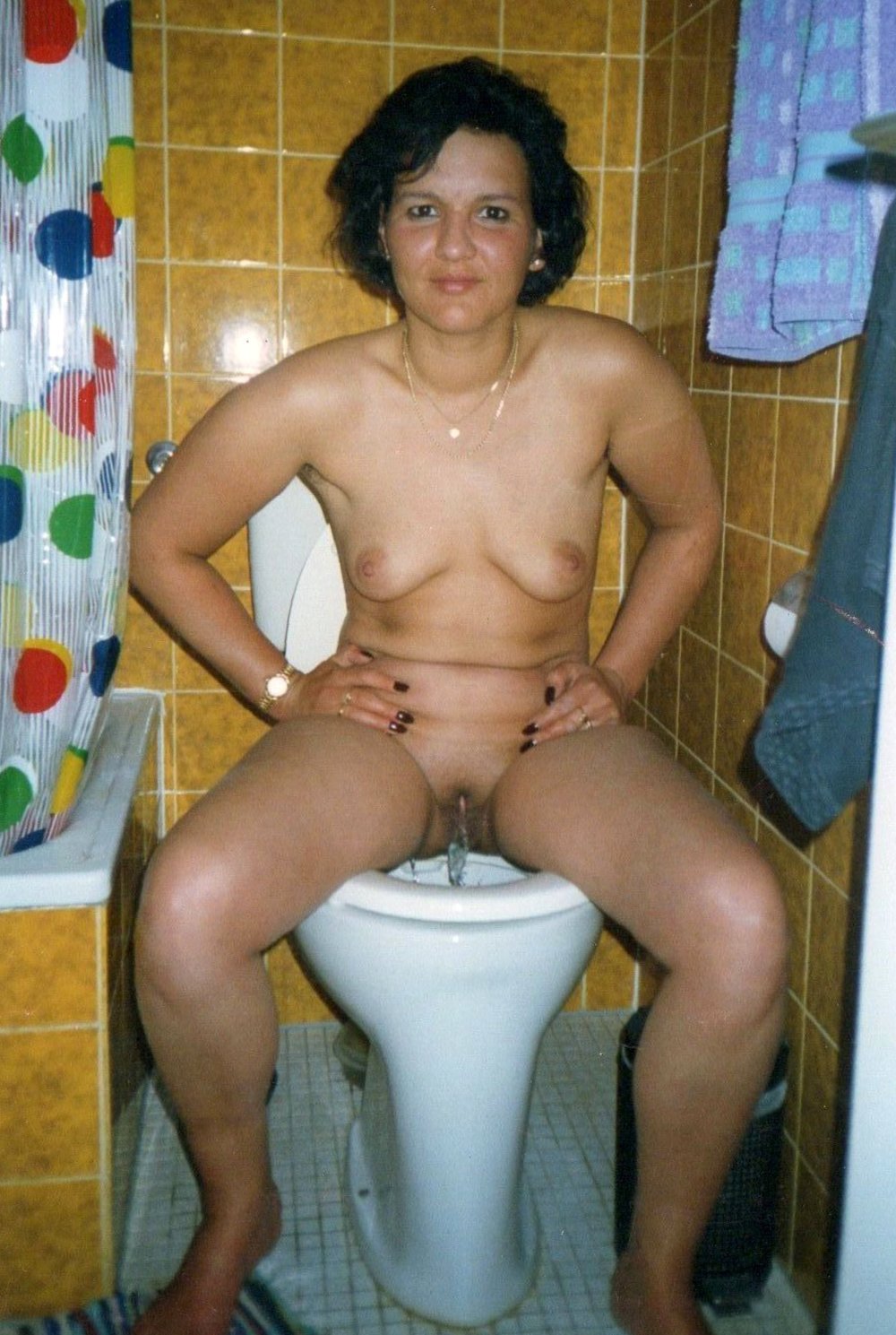 Naked adult women in the toilet