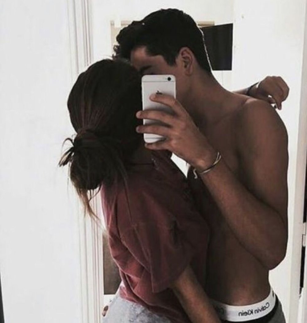 A guy with a girl in the mirror