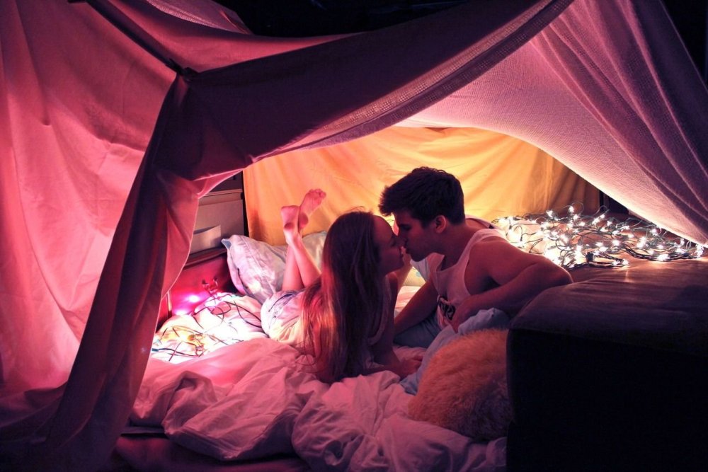 A guy with a girl in a tent
