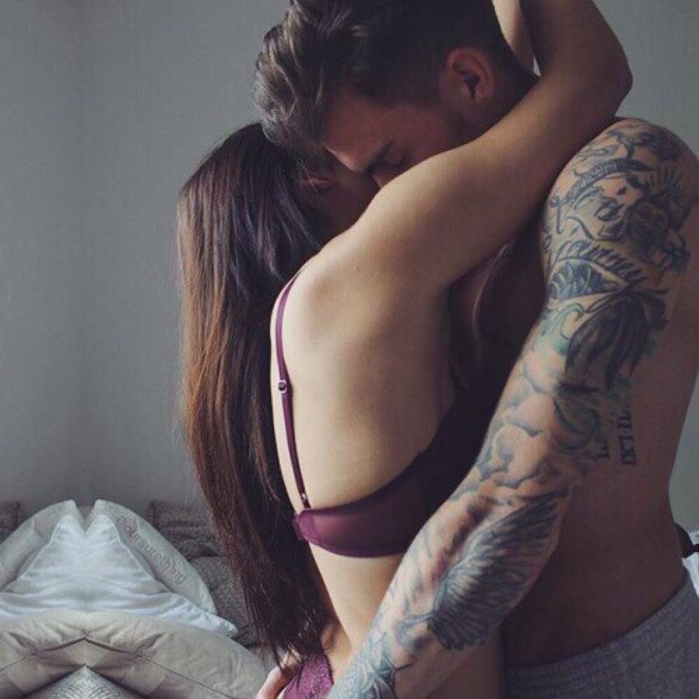 The guy hugs the girl in linen