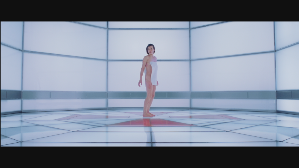 Naked Mila Yovovich in the film Evil Office