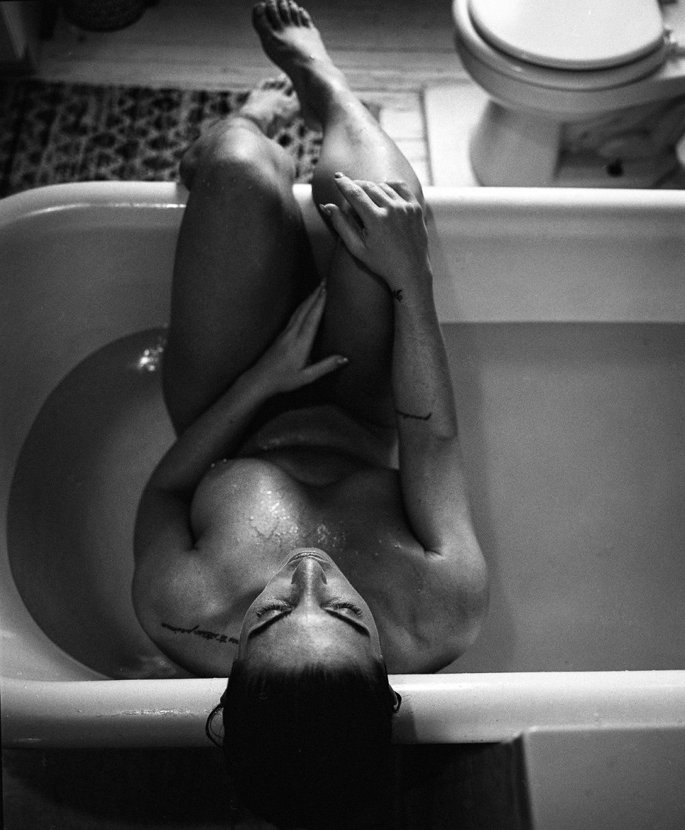 2 women lie in the bathroom naked naked