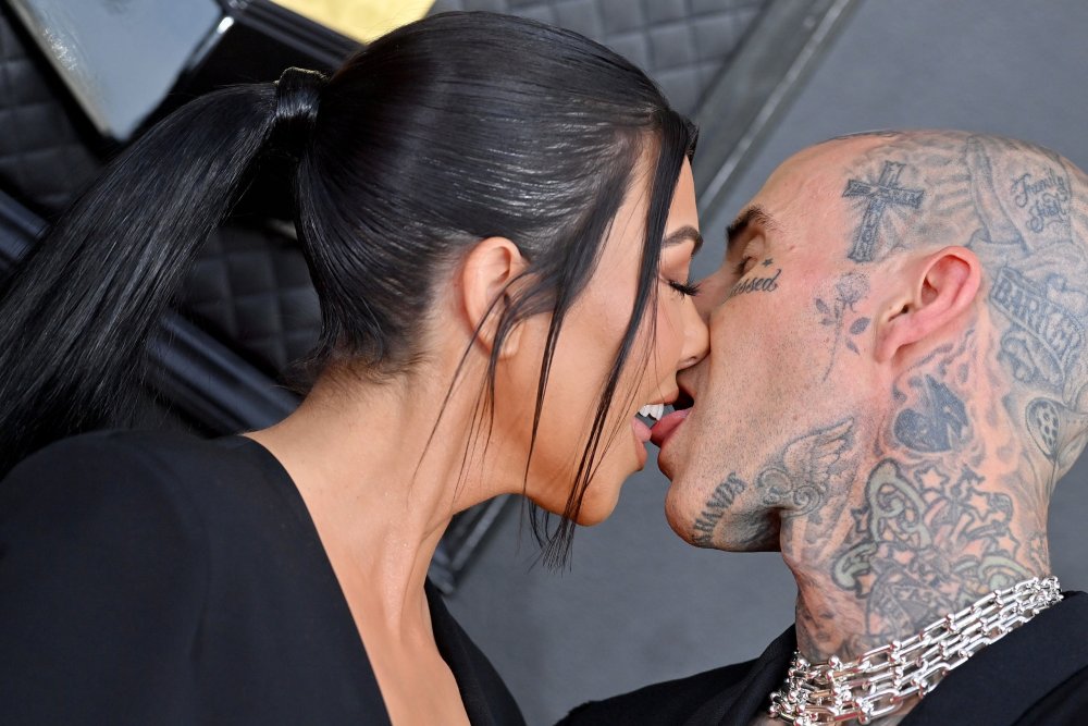 Courtney Kardashian and Travis Barker kiss