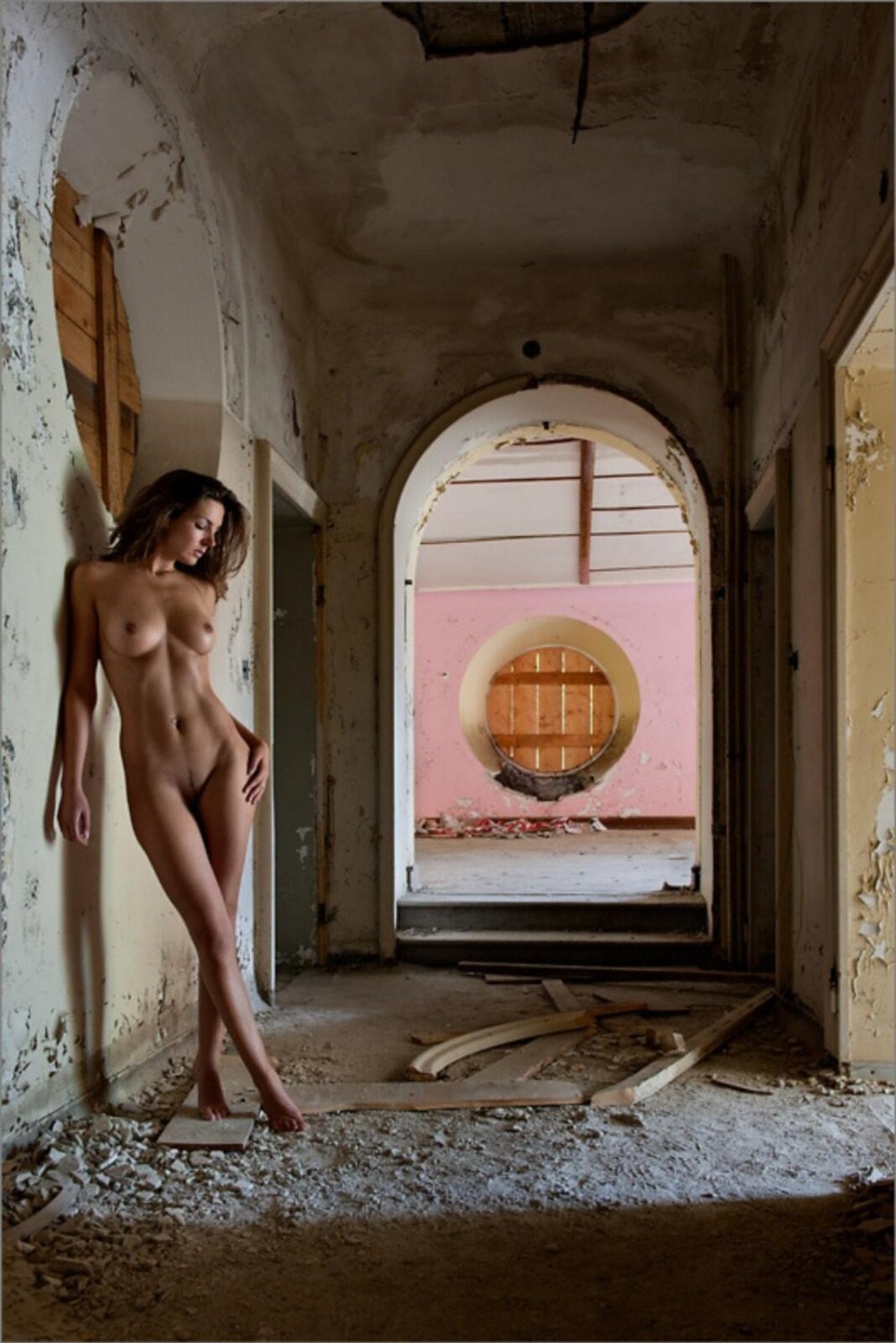 Naked woman in an old house