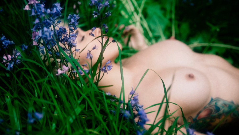 Erotic photo shoot in flowers