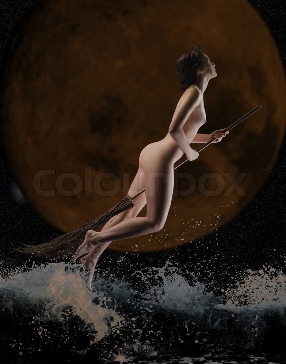 Naked witch on a broomstick