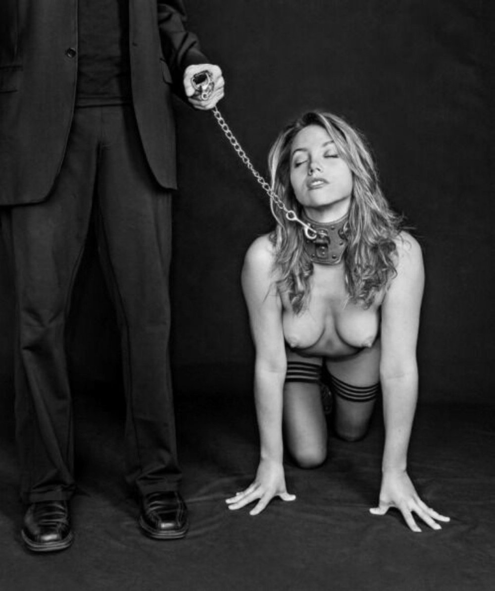 Girl slave on a leash