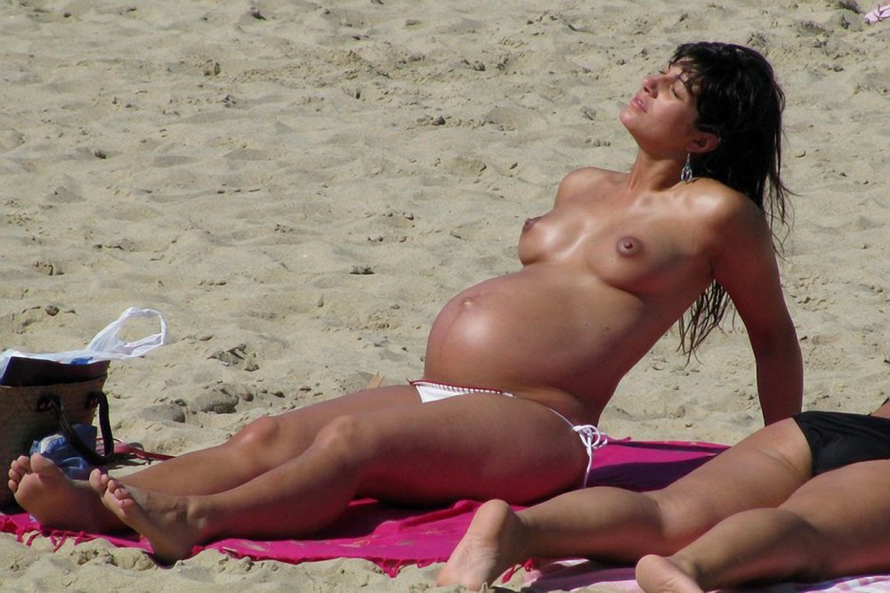 Pregnant nudists on the beach
