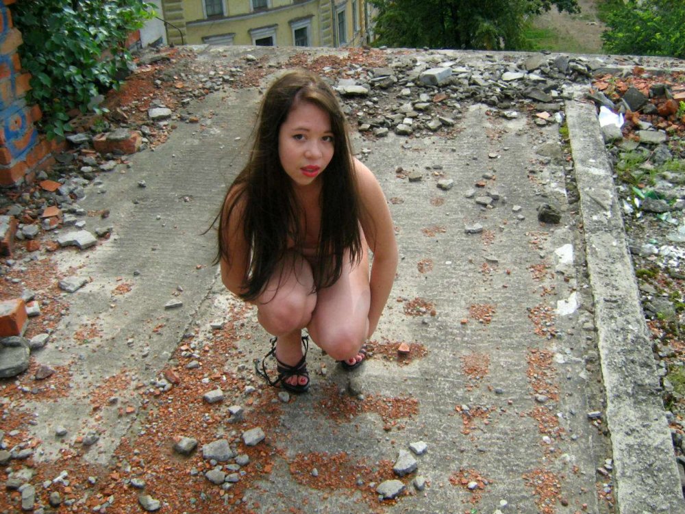 Naked Asian women at a construction site photo