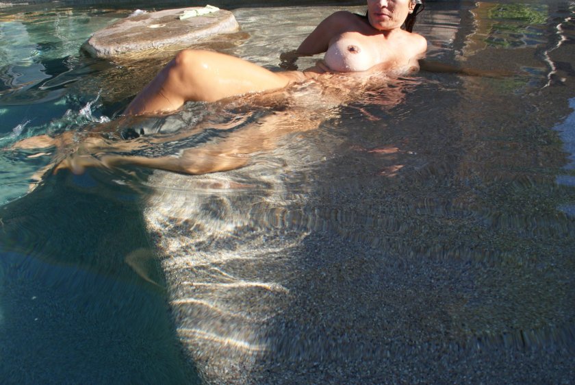 Naked women in a public basin