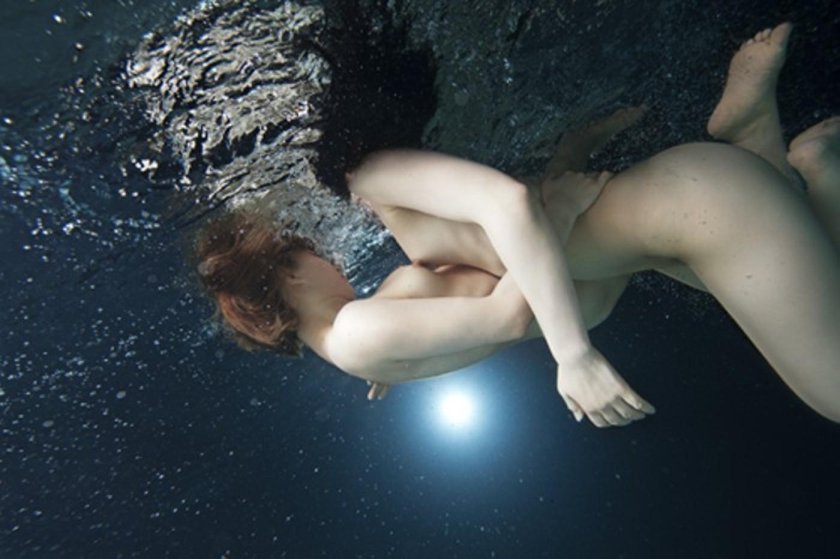 The girl bathes naked