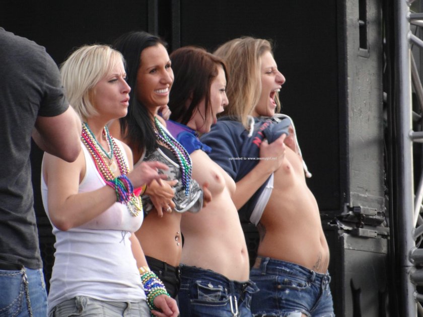 Girls show breasts at the festival