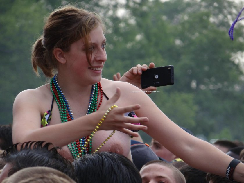A woman with bare breasts at the festival