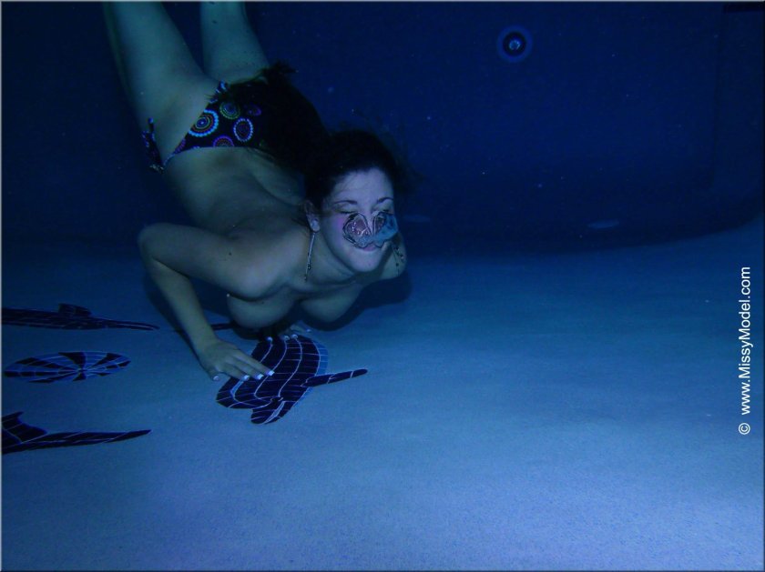 Girl swims under water