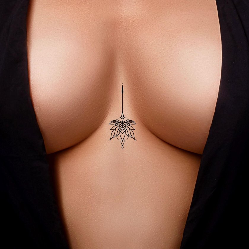 Small tattoos for girls between breasts