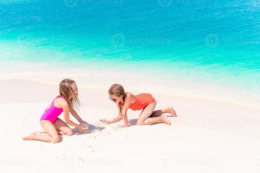 Girls play on the beach