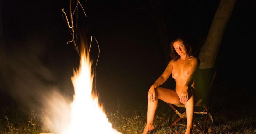 Erotic photo shoot by the fire