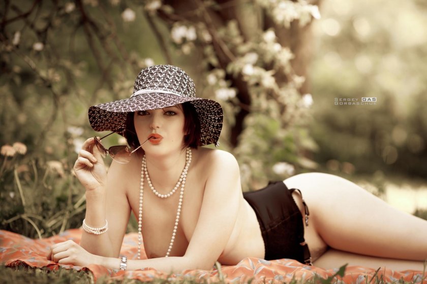 Erotic photo shoot in a hat
