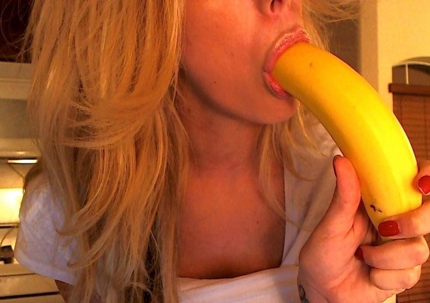Girl with a banana in her mouth