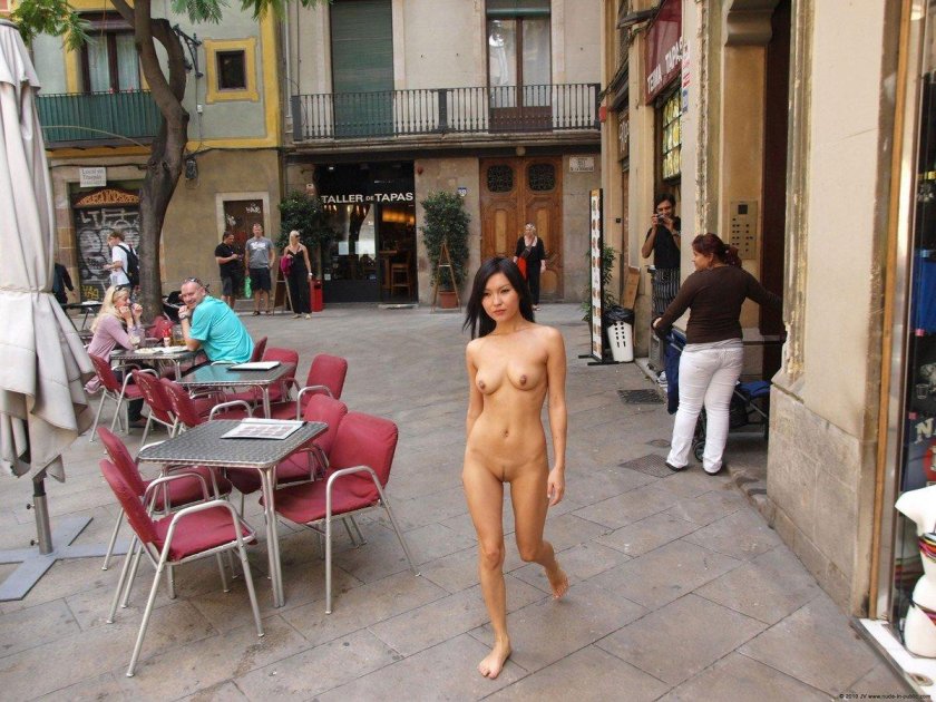Walks naked along the street