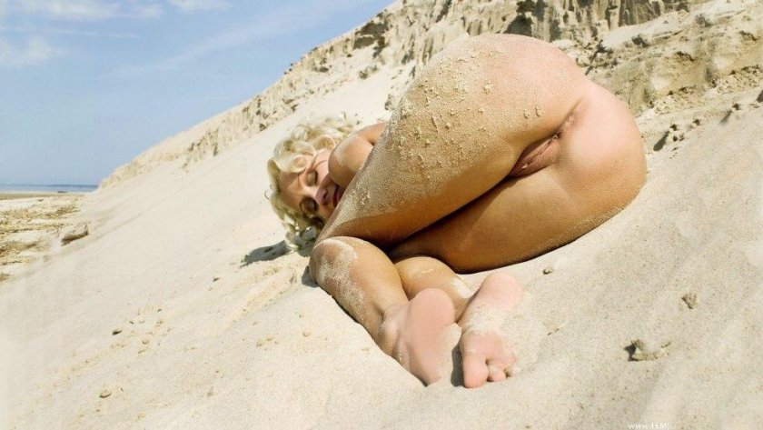 Naked female priests on the beach