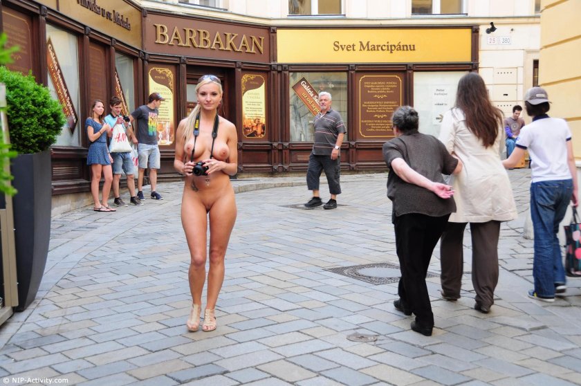 Walks naked along the street