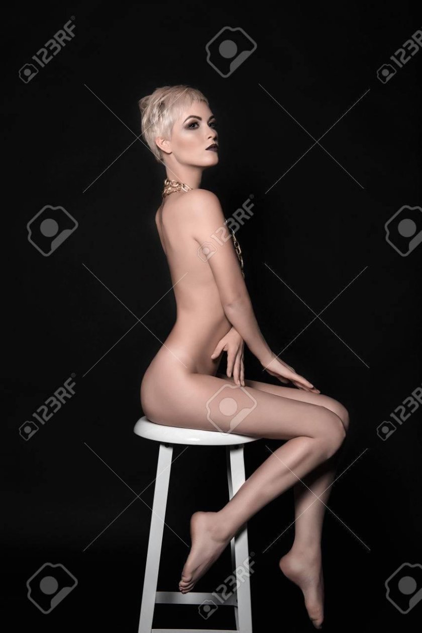 Woman sits in a chair
