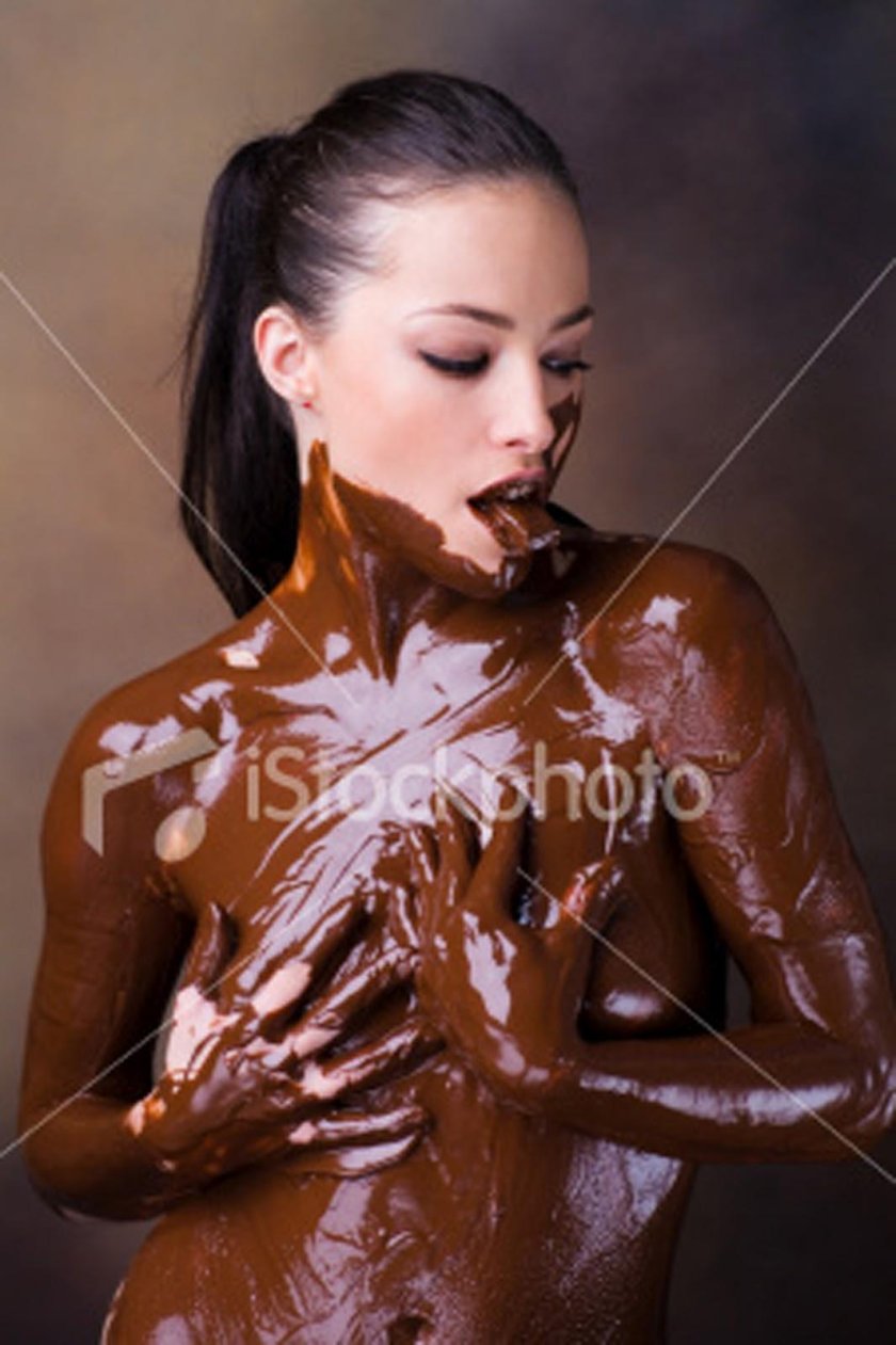 Naked women are coated with chocolate