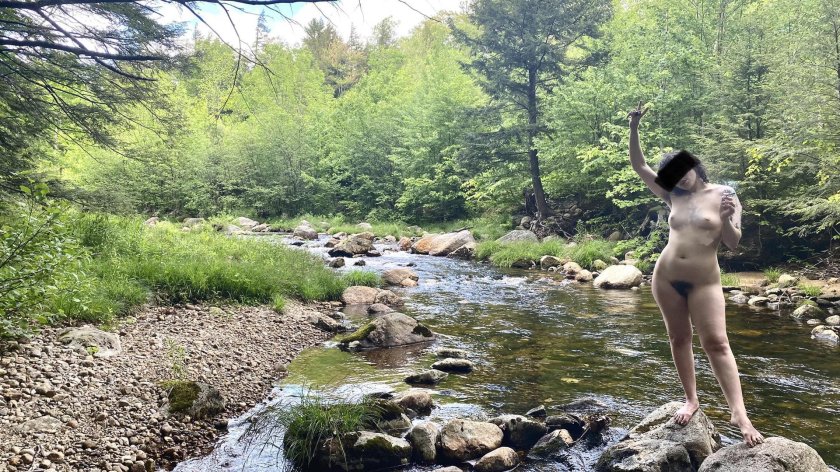 Swimming naked in the river by whole family