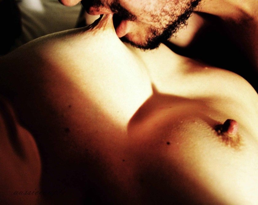 Man kisses the breast to woman