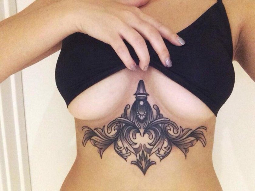 Under the chest tattoo